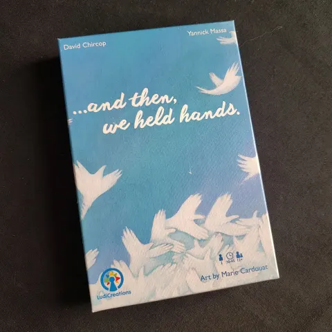 ...and then, we held hands. board game box cover